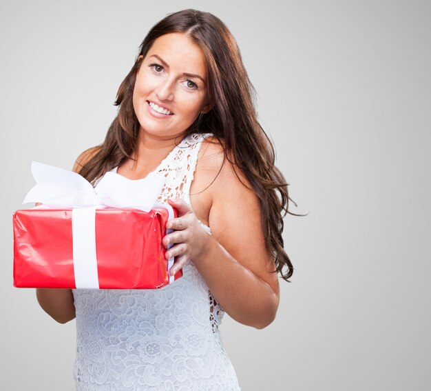 pretty woman holding a gift