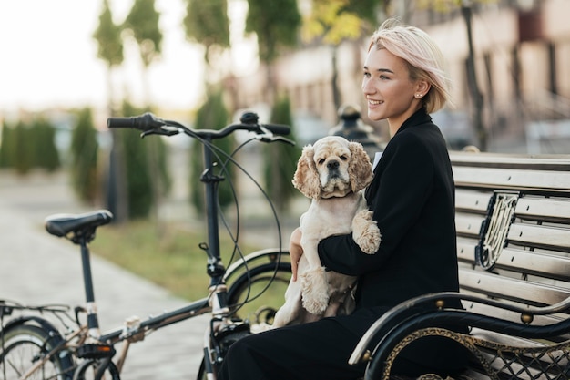 Pretty woman petting her cute dog