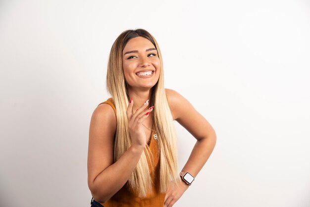 Pretty woman posing on white background.