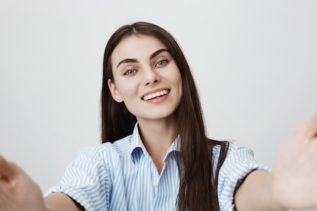 Free photo pretty woman taking selfie, smiling