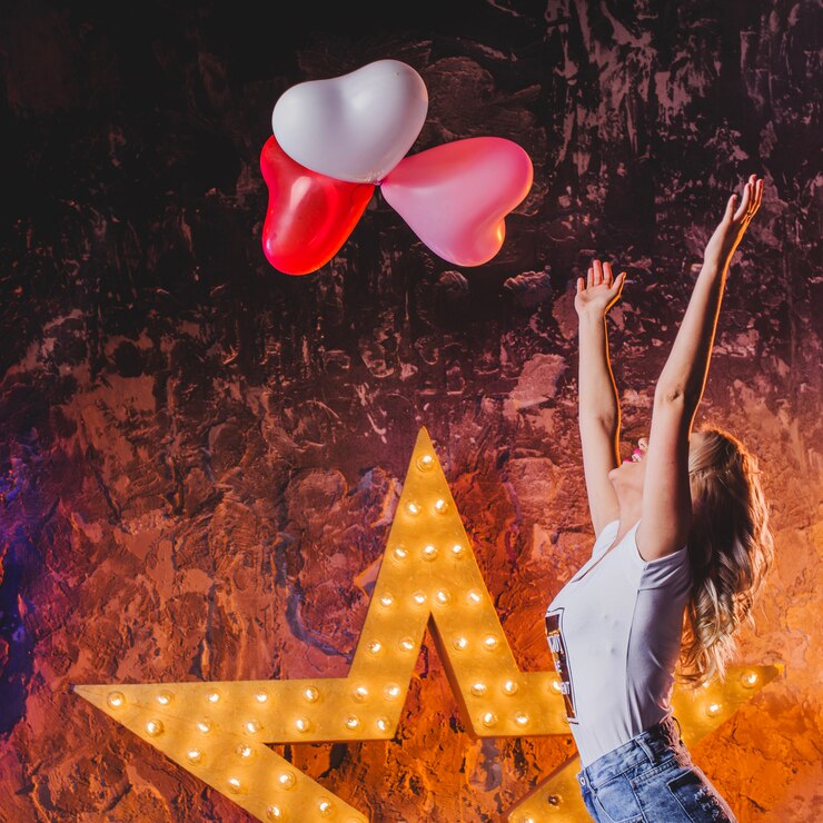 Free Photo pretty woman throwing up balloons