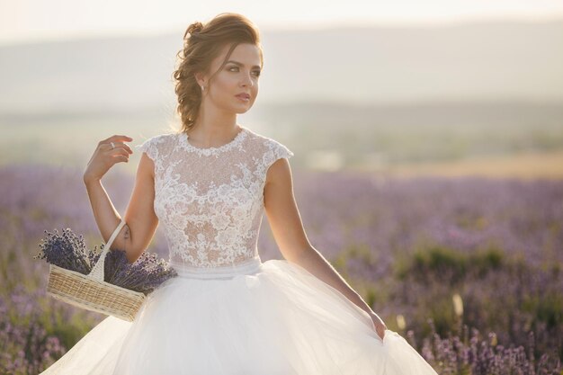 pretty woman in wedding dress in lavender field
