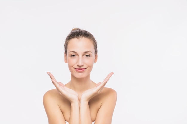 Pretty woman with bare shoulders on white background