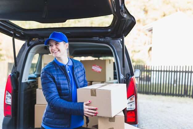 Pretty woman working in delivery service