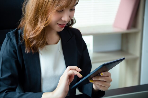 Pretty woman working in the office