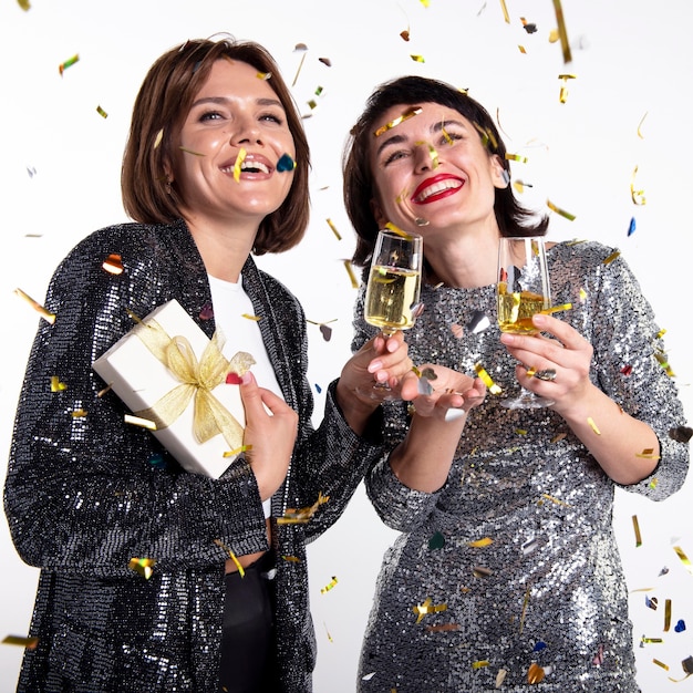 Pretty women celebrating new year's eve at home