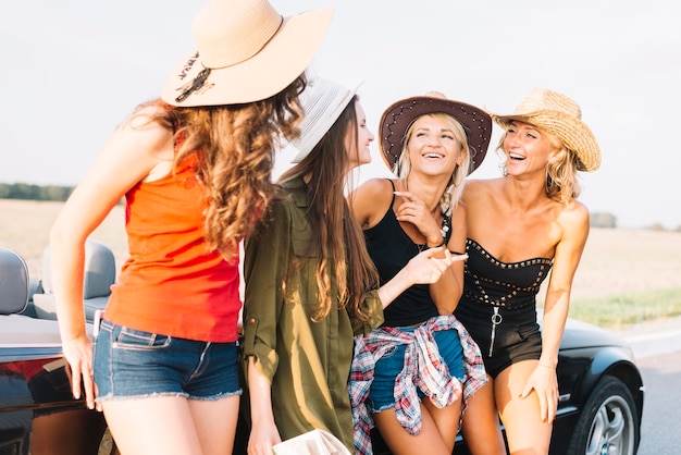 Pretty women near cabriolet