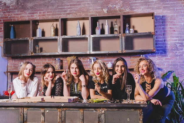 Free photo pretty women standing on kitchen