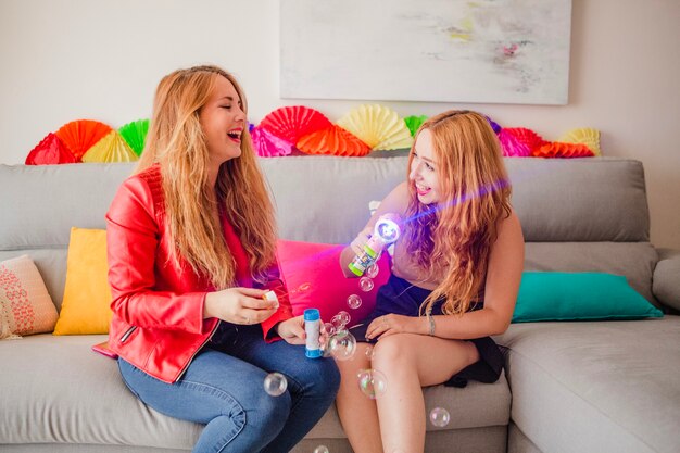 Pretty women with soap bubbles