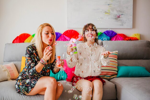 Pretty women with soap bubbles