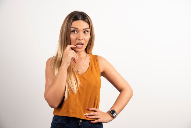 Pretty young adult woman looking at camera and posing.