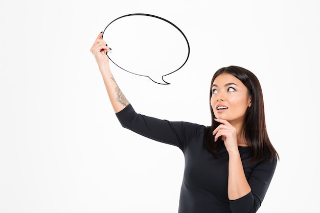 Pretty young asian woman holding speech bubble.