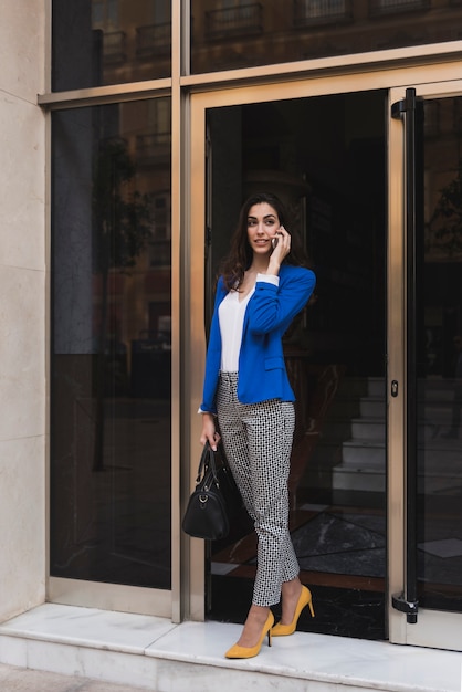 Pretty young executive talking on the phone