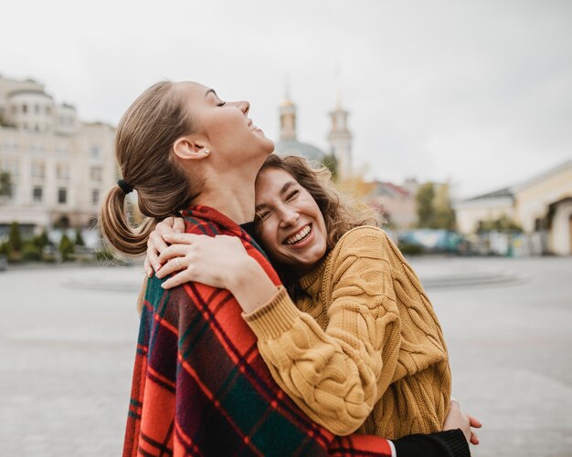 Pretty young girls hugging each other