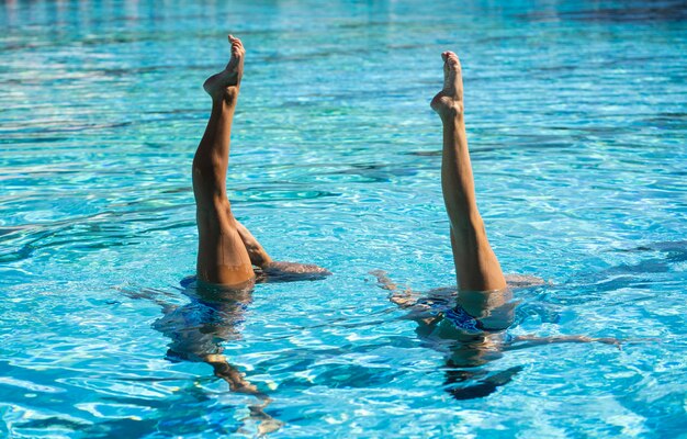 Pretty young girls posing in the water