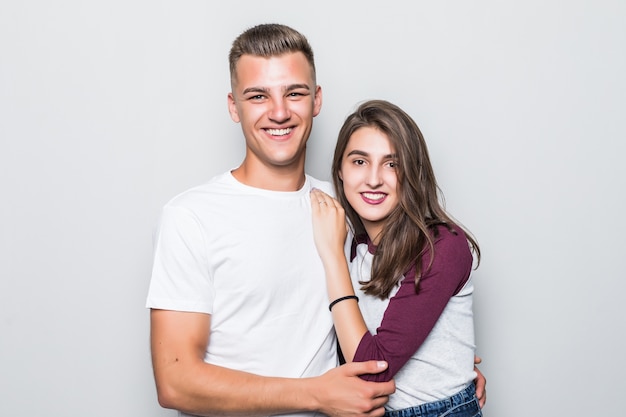 Pretty young handsome boy and girl isolated on white