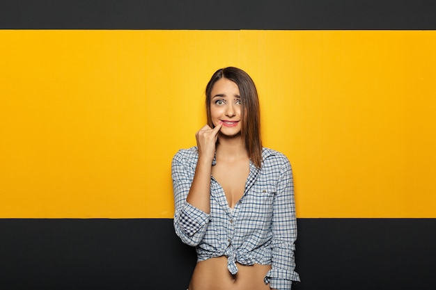 Pretty young lady fooling around in studio