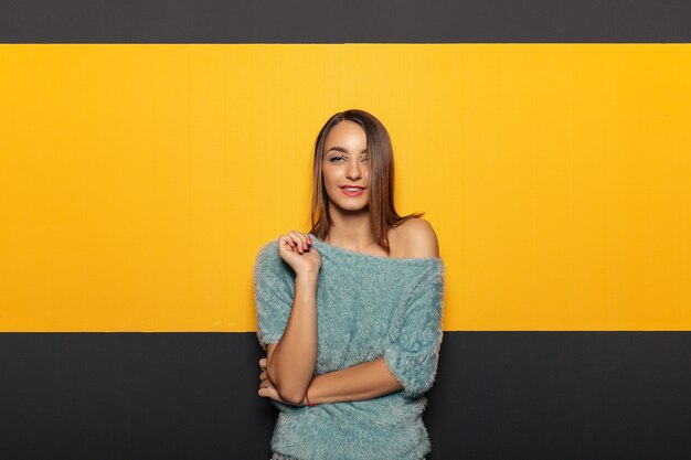 Pretty young lady fooling around in studio