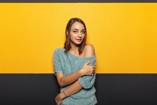 Pretty young lady fooling around in studio