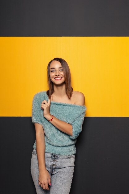 Pretty young lady fooling around in studio