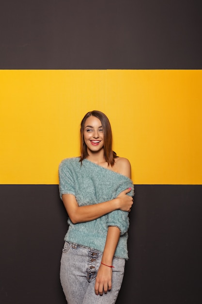 Pretty young lady fooling around in studio