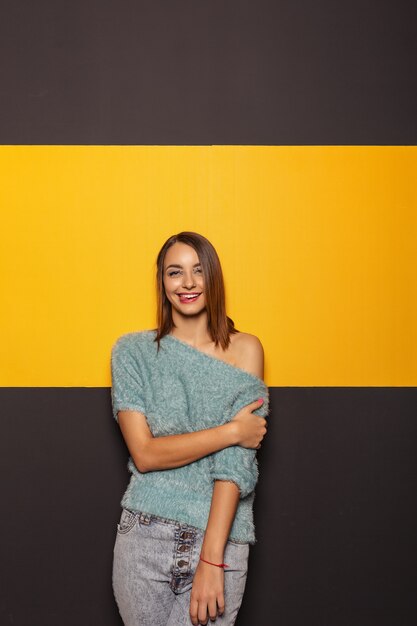 Pretty young lady fooling around in studio