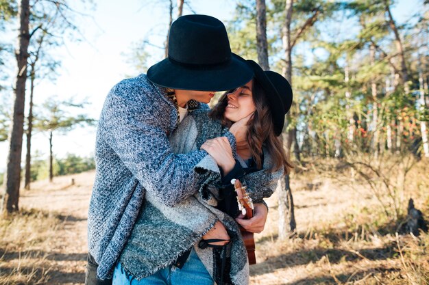 Pretty young man hugging his girlfriend