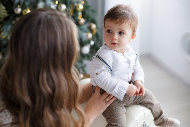 pretty young mother and cute baby at home