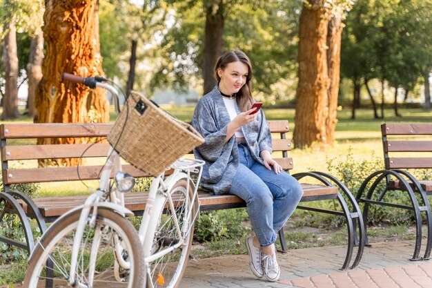 Pretty young woman browsing mobile phone