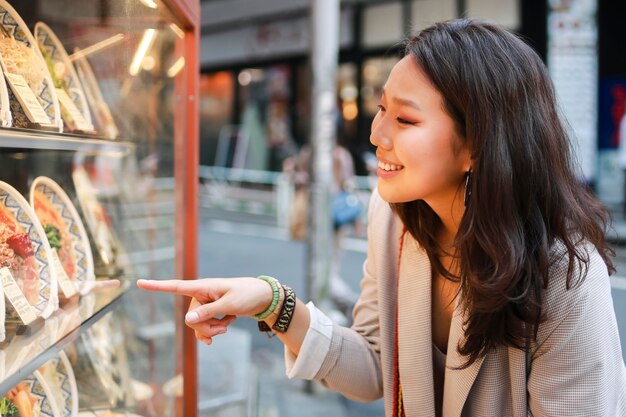 Pretty young woman checking products