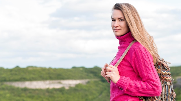 Pretty young woman enjoying trip outdoors