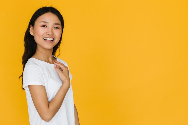 Pretty young woman smiling with copy space