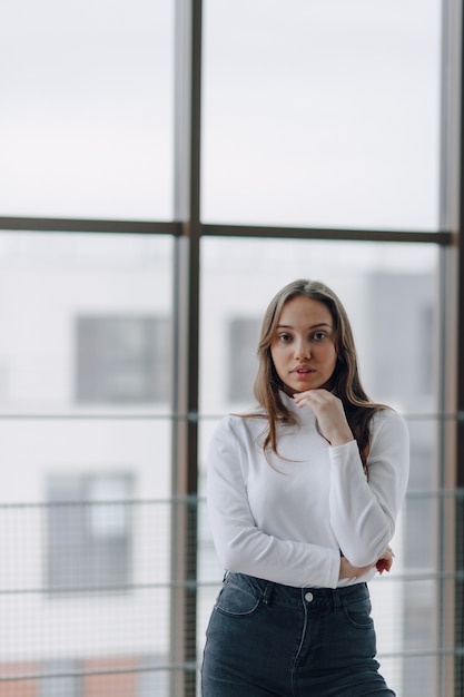 Pretty young woman in a white blouse