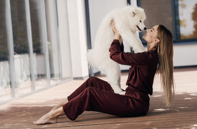 pretty young woman with dog at home