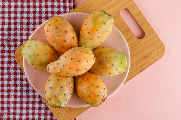 Prickly pears in a plate with cutting board on picnic cloth