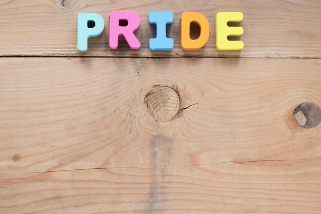 Pride inscription of small letters on table