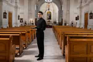 Free photo priest inside church building