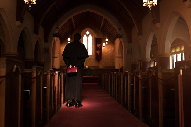 Priest reading from bible