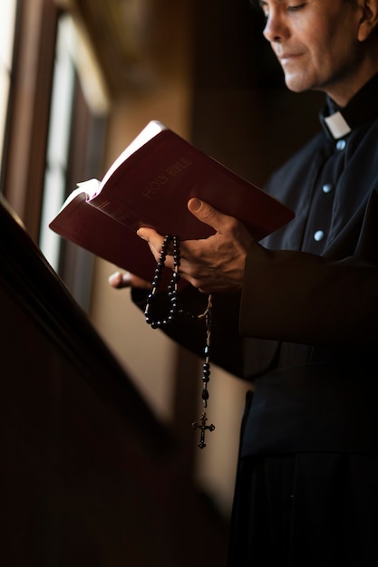 Priest reading from bible