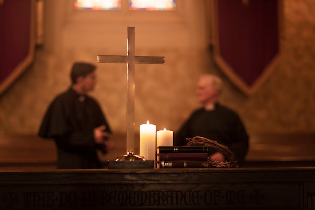 Free photo priests praying together in church