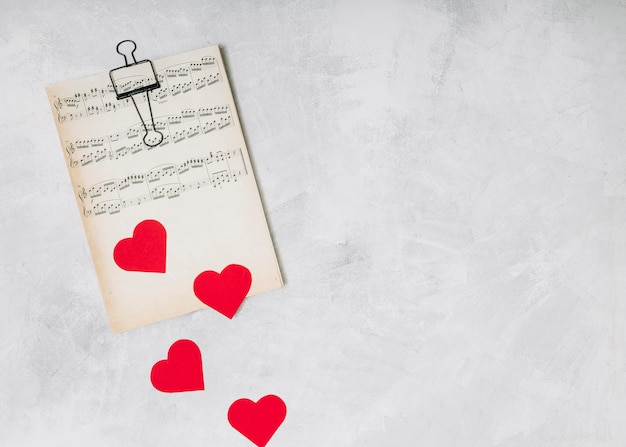 Printed music near ornament hearts 