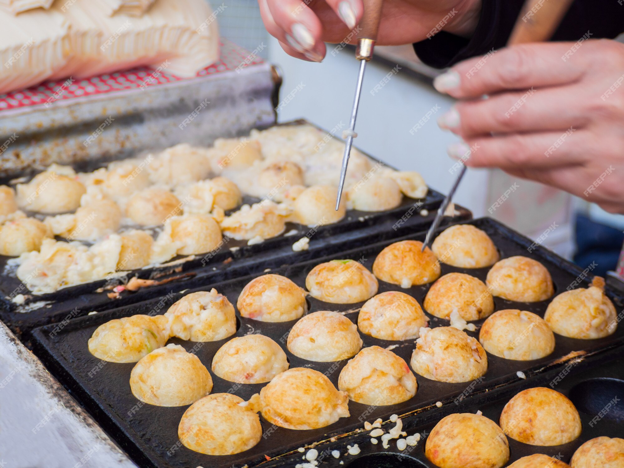 Premium Photo | Process to cooking takoyaki ball dumplings on hot pan. takoyaki is a most famous japanese snack food in japan.