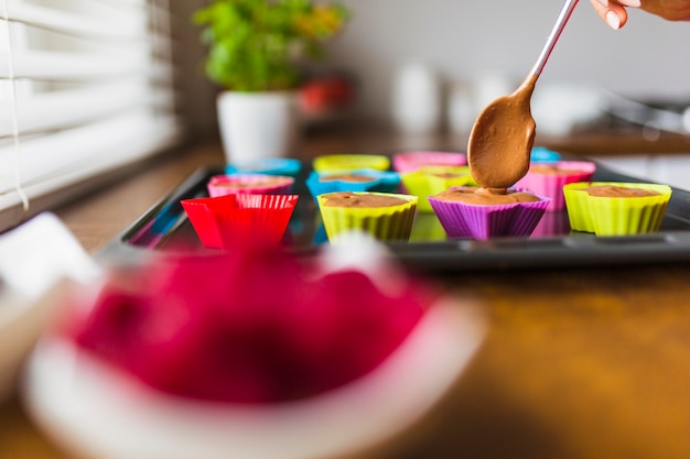 Free photo process of filling baking cups