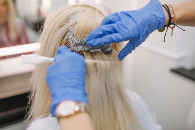Process of hair coloring in hairdresser parlor