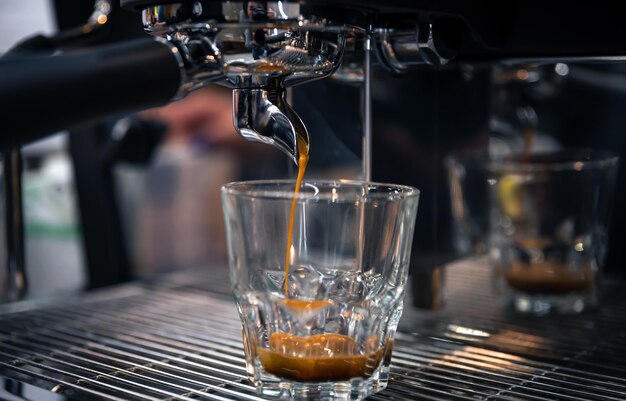 The process of preparing espresso in a professional coffee machine closeup