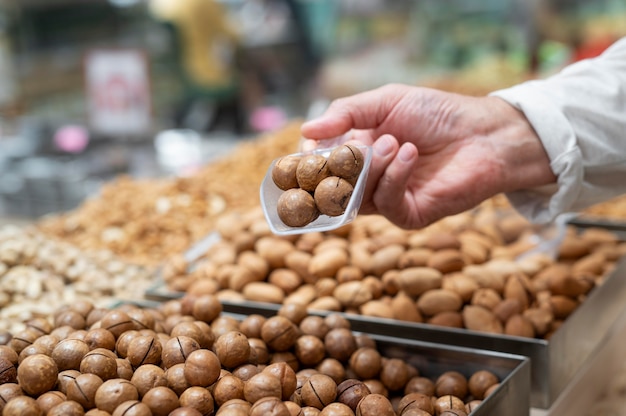 Producer at his shop with different goodies