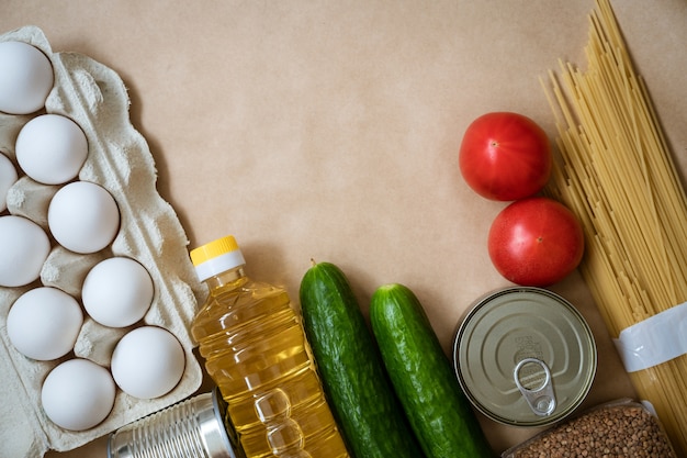 Products lie on the table, eggs cereals and vegetables