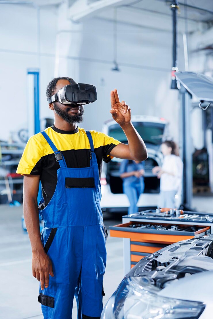 Free Photo professional in auto repair shop using virtual reality technology to visualize car alternator in order to fix it effective garage employee wearing futuristic vr headset while mending faulty vehicle