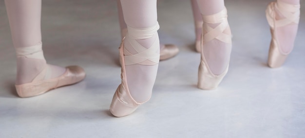 Professional ballet dancers training together in pointe shoes