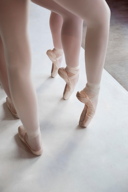 Professional ballet dancers training together while wearing pointe shoes